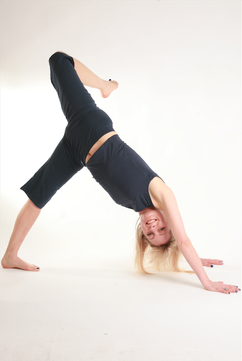 Emma bent in yoga pose